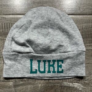 Gray baby hat with Green Text